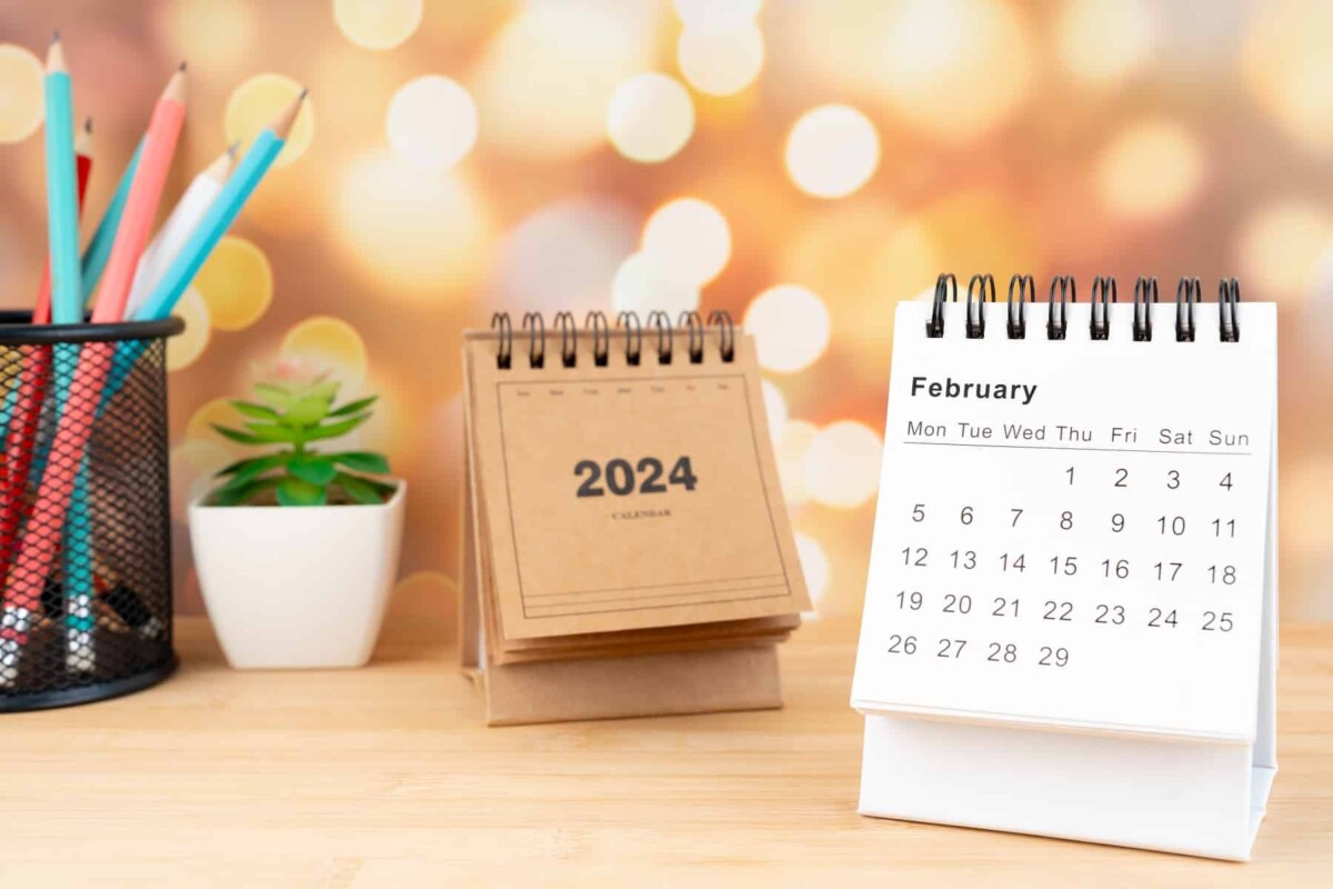 White,February,2024,Desk,Calendar,On,Wooden,Table,With,Gold