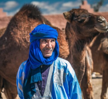 Berber,And,His,Camel,Dressed,In,Traditional,Clothes,And,Turban.