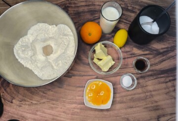 Sastojci za domaće krafne pripremljeni na radnoj površini prije izrade tijesta